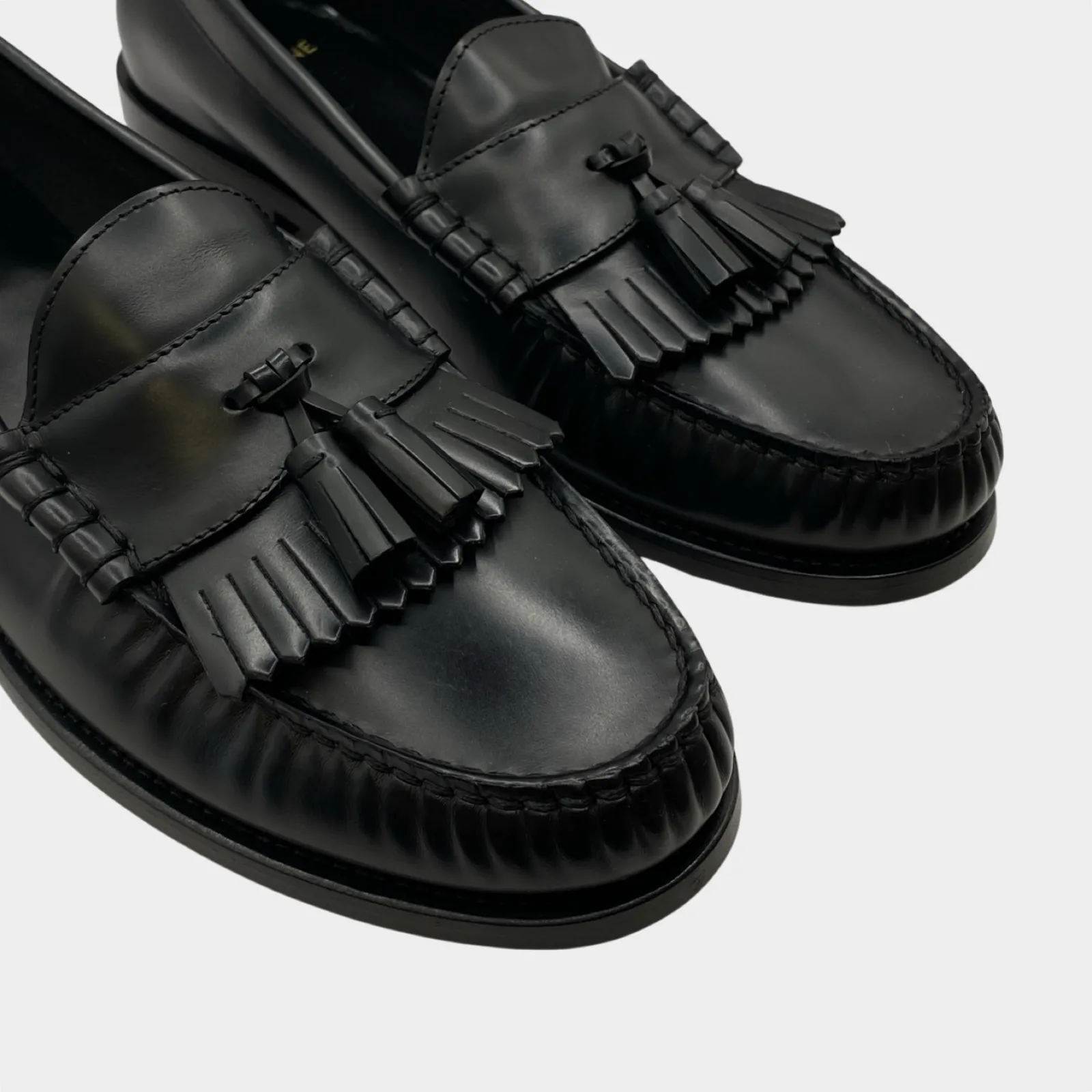 Celine black leather tassle loafers